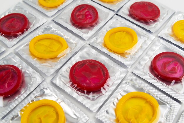 High angle red and yellow condoms