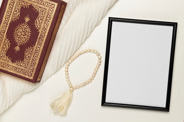 Free photo high angle religious book and bracelet