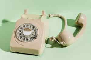 Free photo high angle of retro telephone with receiver