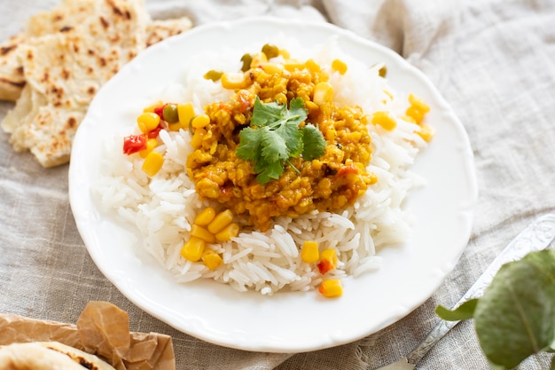 High angle rice with green peas and corn