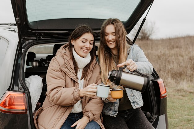 High angle road trip break with tea