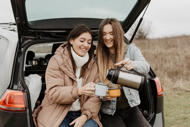 High angle road trip break with tea