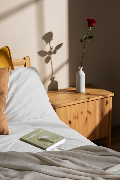 High angle rose and book in bedroom