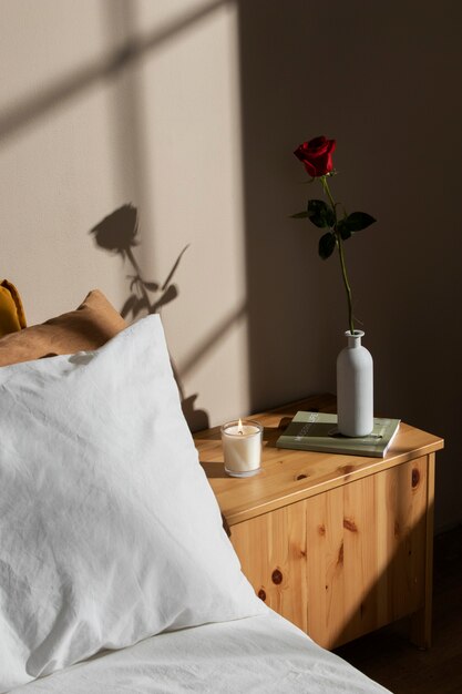 High angle rose and book on nightstand