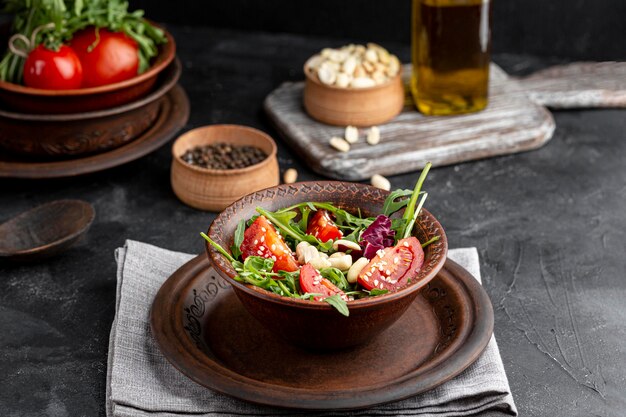 High angle salad with different ingredients on brown bowl