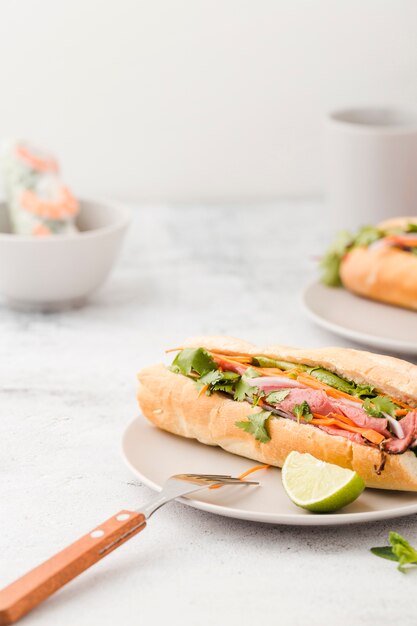 High angle of sandwich with ham and fork