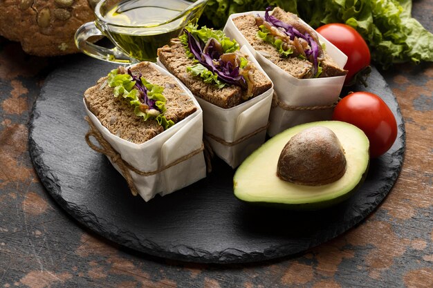 High angle of sandwiches with avocado and tomatoes