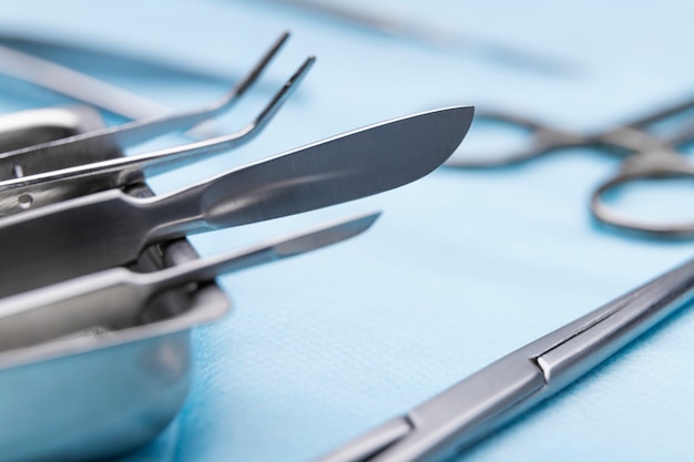 High angle of scalpel with other medical instruments
