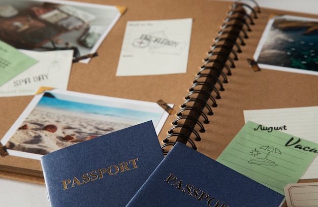 Free photo high angle scrapbook and passports arrangement