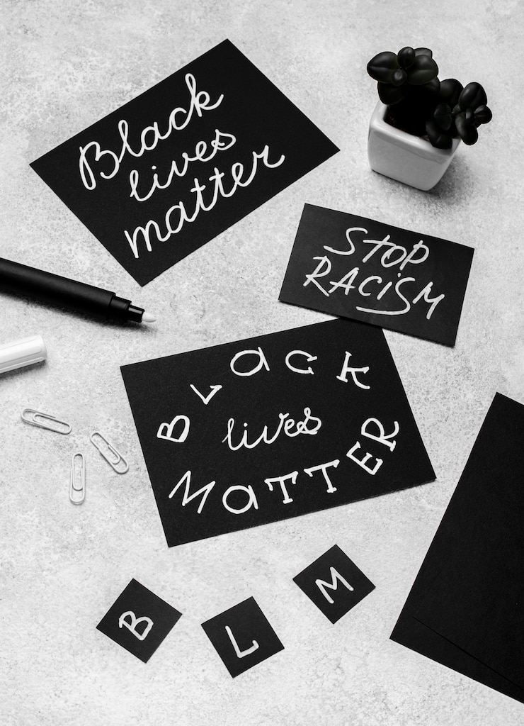 Free Photo high angle of selection of cards with black lives matter with plant