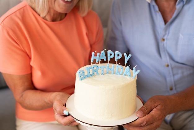 Free photo high angle senior couple celebrating birthday