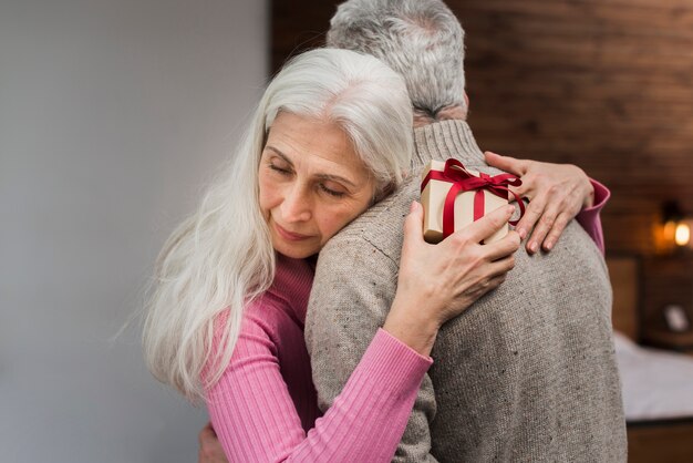 High angle senior couple hugging