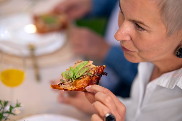 Free photo high angle senior with delicious food