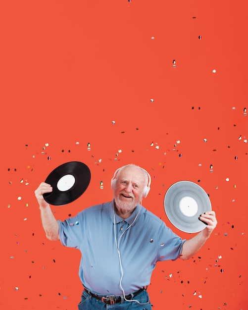 High angle senior with music records