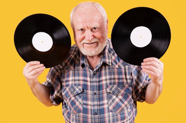 High angle senior with two record music