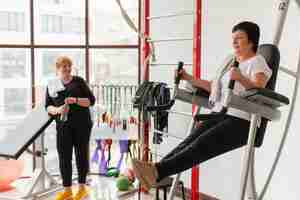 Free photo high angle senior women at gym