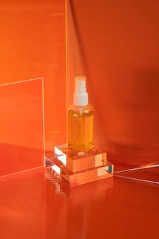 High angle serum bottle with red background
