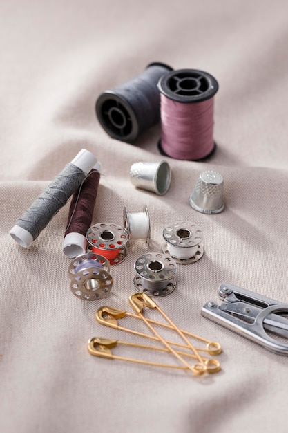 High angle of sewing machine shuttles with thread reels and safety pins