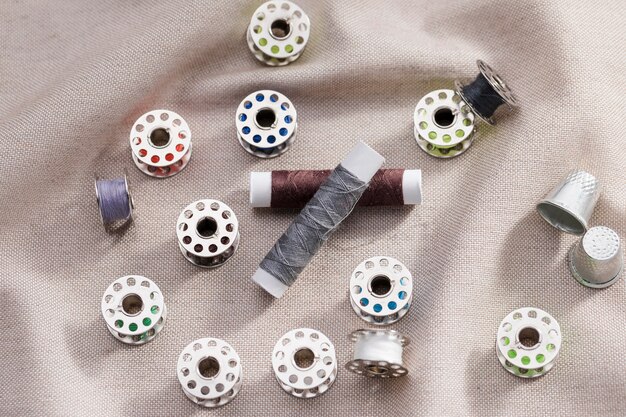 High angle of sewing machine shuttles with thread reels and thimbles