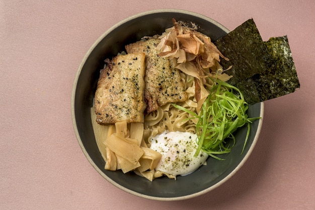 High angle shot of Asian meal with salmon and seasonings