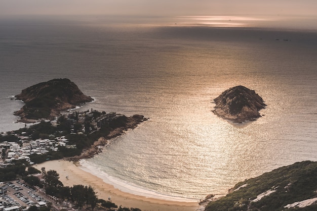 High angle shot of the beautiful beach by the bay under the amazing clouds in the sky