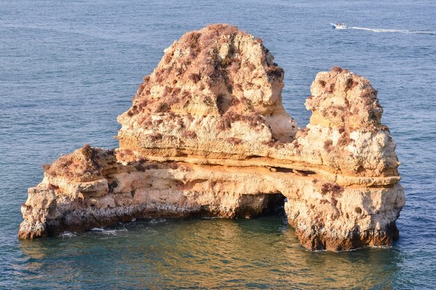 High angle shot of a beautiful rock formation in the middle of the sea