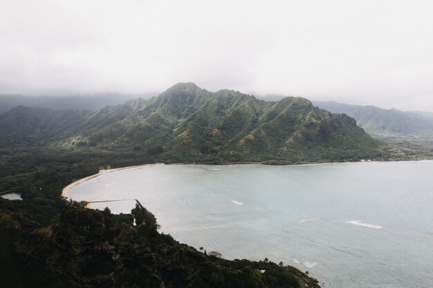 High angle shot of a beautiful seashore with a white cloudy sky