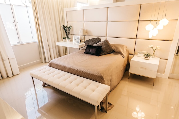 High angle shot of a bedroom with interior stuff in beige tones