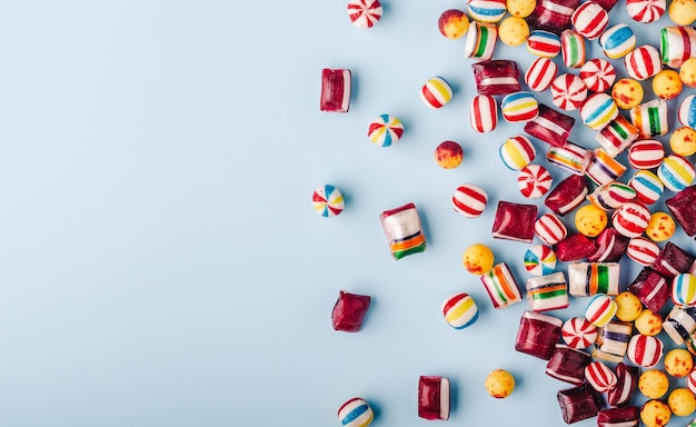 Free photo high angle shot of colorful candies on a light blue background