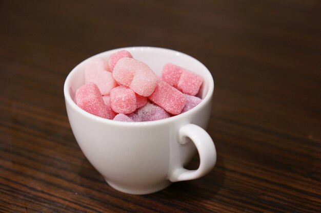 High angle shot of a cup filled with jelly candy