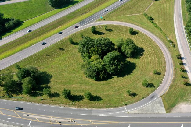 High angle shot of an exit with shrubs and green grass