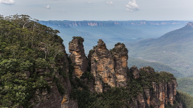 High angle shot of forested mountain under a cloudy sky