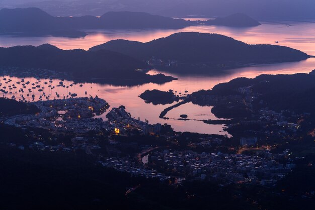 High angle shot of the harbor by the sea captured in the beautiful colors of the twilight