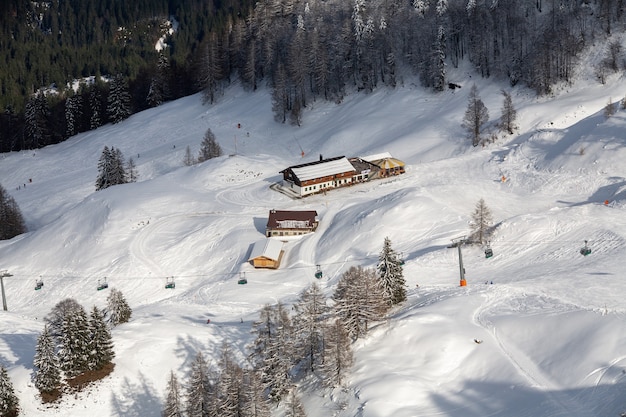 High angle shot of houses in the snowy mountains