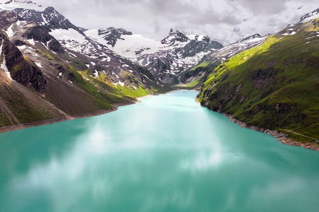 High angle shot of a lake in the mountains captured on a cloudy day