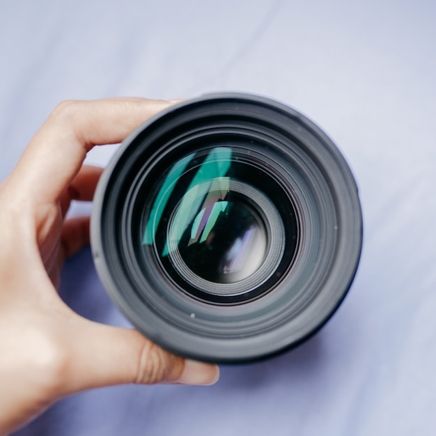 High angle shot of a person holding a camera lens