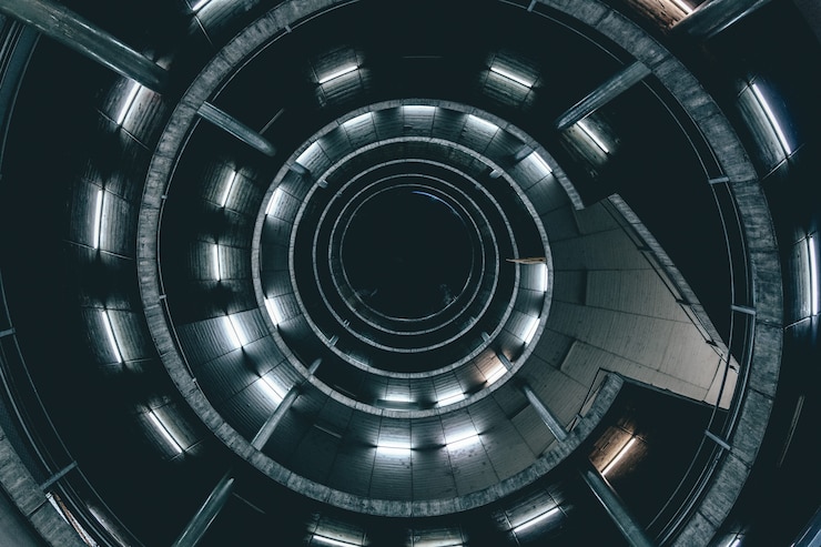 Free Photo high angle shot of a spiral ladder with lights