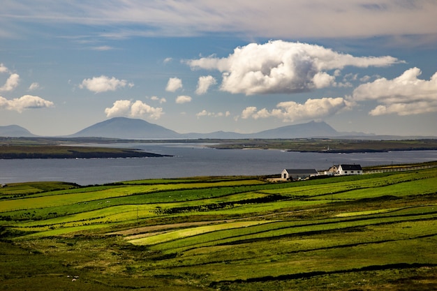 High angle shot of a valley next to the sea in the Near Ballycastle of the County Mayo in Ireland