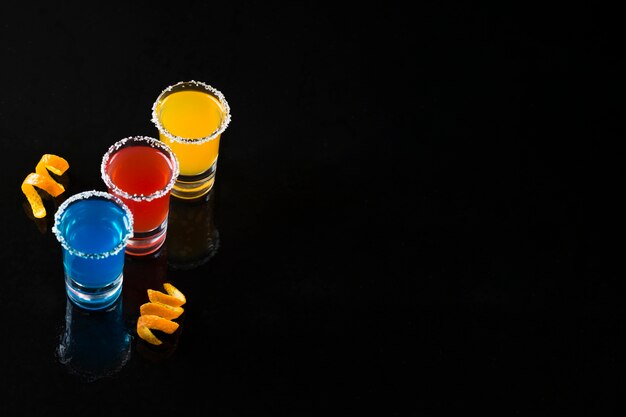 High angle of shots with cocktails and copy space