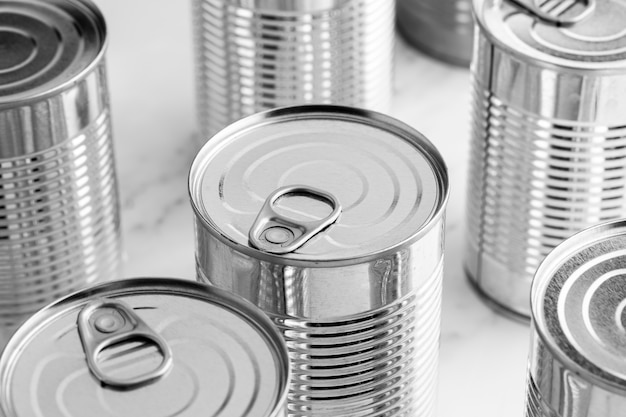 Free photo high angle silver tall tin cans