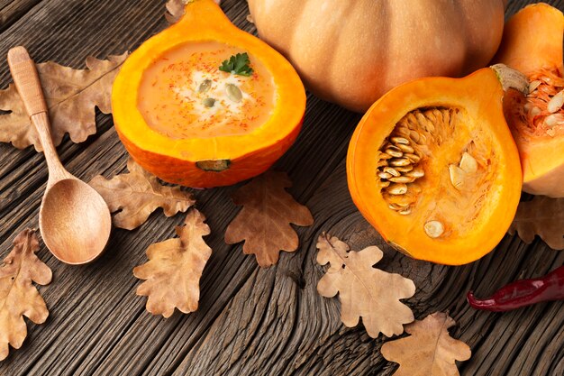 High angle sliced pumpkin and wooden spoon