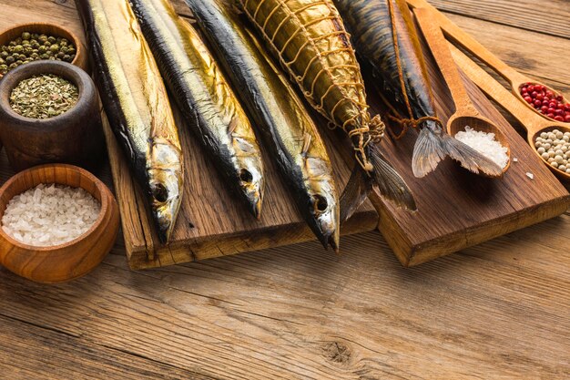 High angle smoked fishes on wooden table
