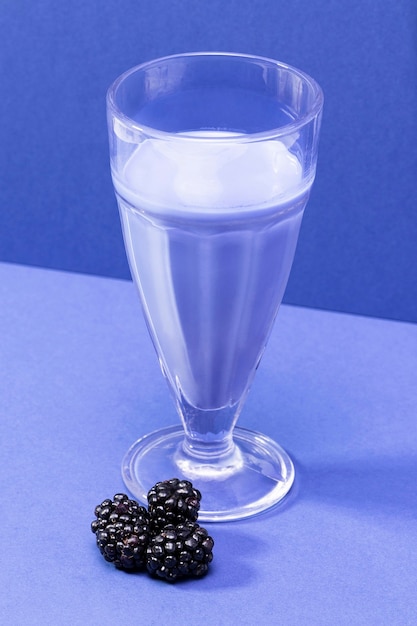 High angle smoothie in glass with blackberries