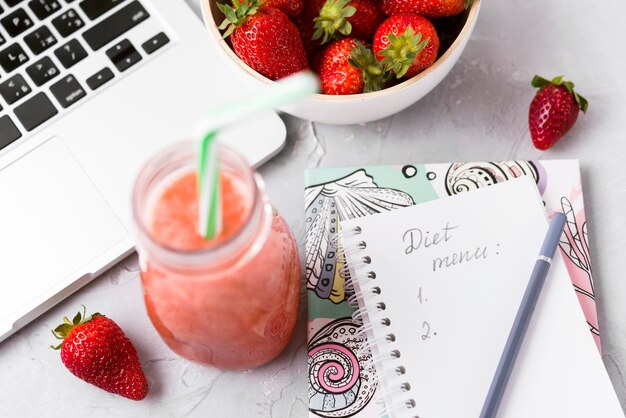 High angle smoothie and keyboard