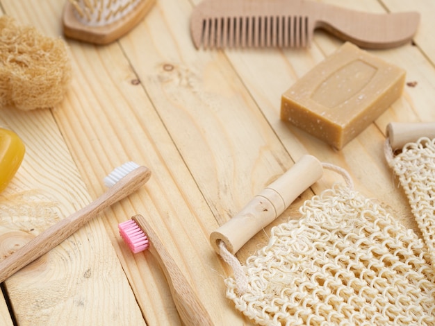 High angle soap and sponge on wooden background