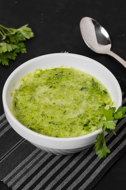 High angle of soup bowl with parsley