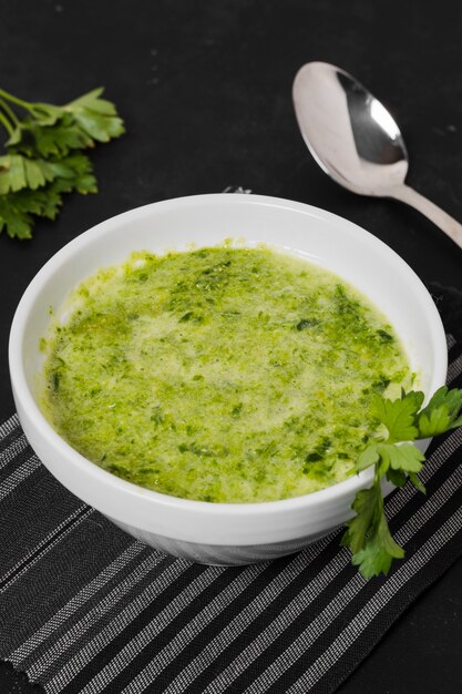 High angle of soup bowl with parsley