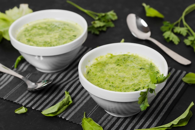 High angle of soup bowls with parsley