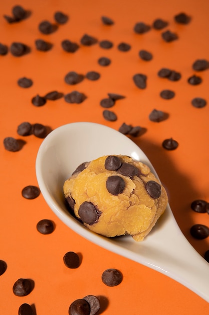 Free photo high angle spoon with delicious cookie dough