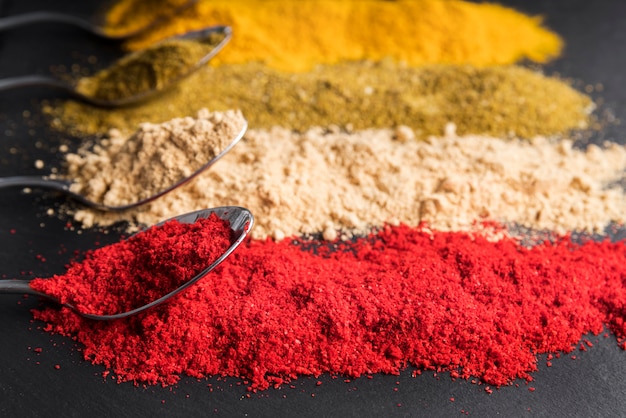 High angle spoons with colorful powder